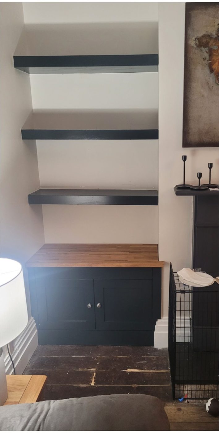 After: alcove beside a black fireplace